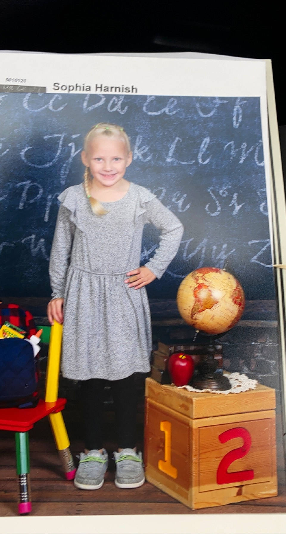 Sophia Harnish joined the competition — help win amazing prizes! advertising, blackboard, calabaza, chair, child, dress, event, fashion_design, joy, local_food, pattern, person, room, sandal, smile, teacher, toddler, toy, vegetable, visual_arts