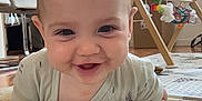 Liam participe au concours pour gagner de l'argent avec cette photo : baby, chair, child, clothing, cute, floor, furniture, hand, happy, head, indoor, infant, pacifier, play_mat, playtime, room, smiling, toy, window, wooden