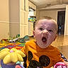 Rhyker is registered to the contest to win money with this photo: architecture, baby, balloon, building, cabinet, diningroom, diningtable, door, face, furniture, head, indoors, livingroom, person, photography, portrait, purple, room, table, yawning