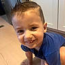 Rhyker joined the competition — help win amazing prizes! child, toddler, smiling, happy, indoor, floor, hand, blue_shirt, hair, face, candid, person, kitchen, cabinet, barefoot, cute, young, skin, expression, holding
