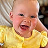 Sophia is registered to the contest to win money with this photo: baby, child, smiling, yellow_clothing, happy, face, cheeks, person, portrait, infant, cute, human, baby_girl, closeup, indoor, skin, eyes, hands, sitting, joyful