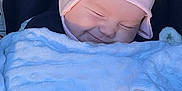 Delilah May is registered to the contest to win money with this photo: baby, bed, blanket, bonnet, clothing, face, furniture, happy, hat, head, newborn, person, photography, portrait, quilt, sleeping, smile