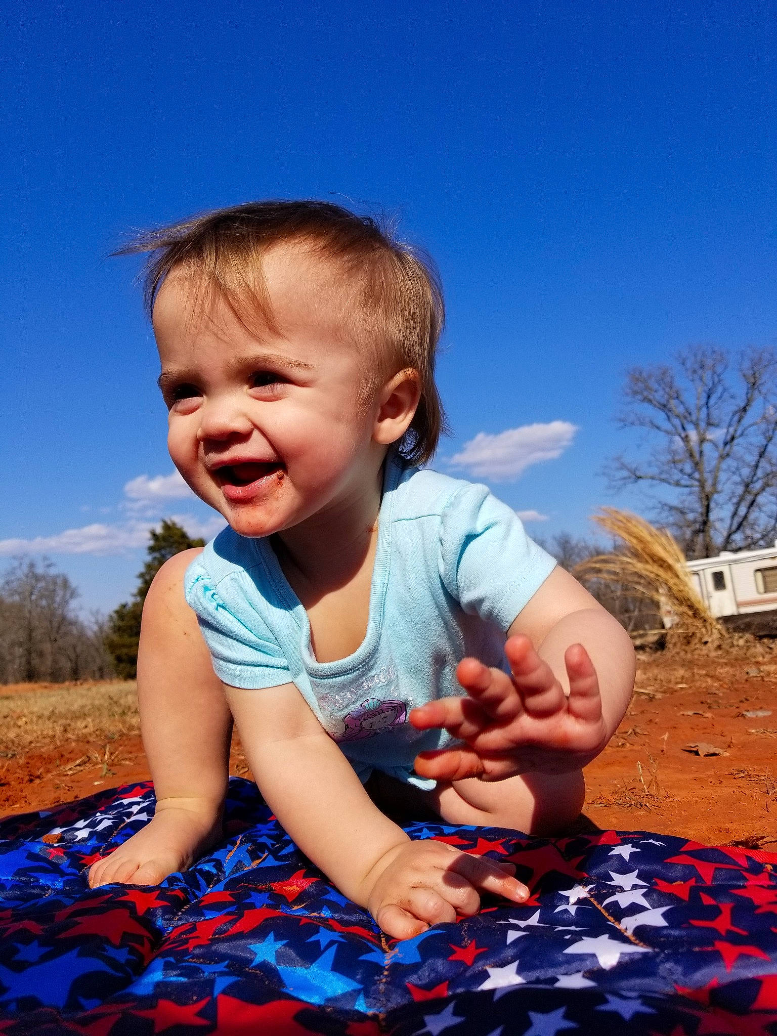 Cara joined the competition — help win amazing prizes! baby, blue, child, facial_expression, finger, fun, gesture, hand, happy, person, photography, play, sitting, sky, smile, summer, toddler, vacation