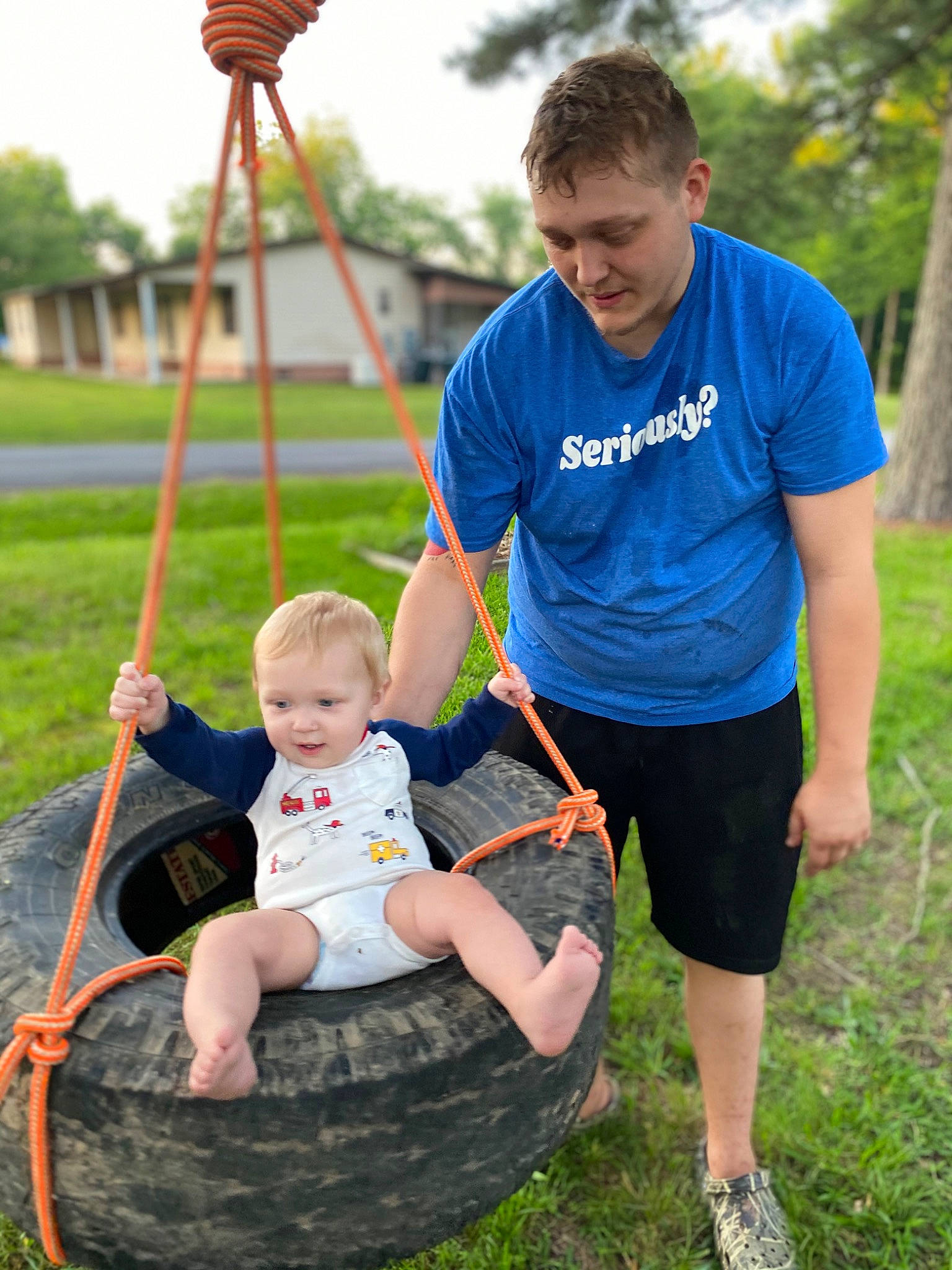 Mykah joined the competition — help win amazing prizes! baby, fun, grass, grassland, green, happy, lawn, leisure, people_in_nature, person, photograph, plant, recreation, red, shorts, sky, summer, swing, toddler, tree