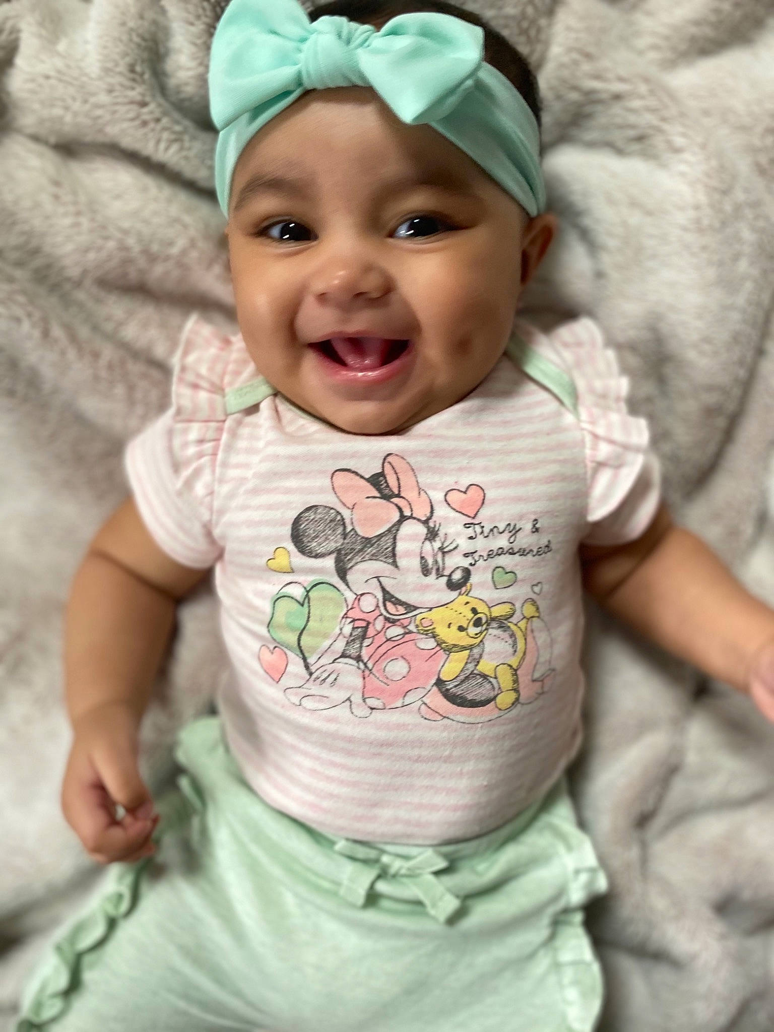 Aleena is registered to the contest to win money with this photo: baby, baby_toddler_clothing, cap, cheek, clothing, eye, face, green, happy, head, headwear, human_body, joy, lip, neck, outerwear, person, photograph, skin, sleeve