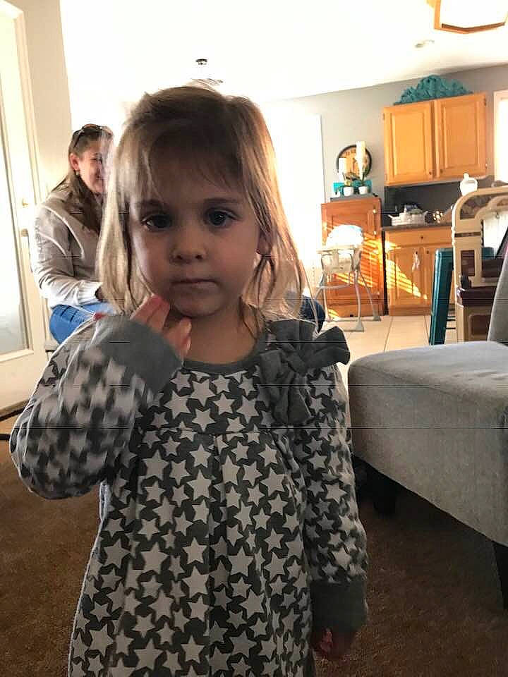 Adalyne joined the competition — help win amazing prizes! child, ear, face, head, long_hair, outerwear, person, room, shoulder, sleeve, smile, toddler