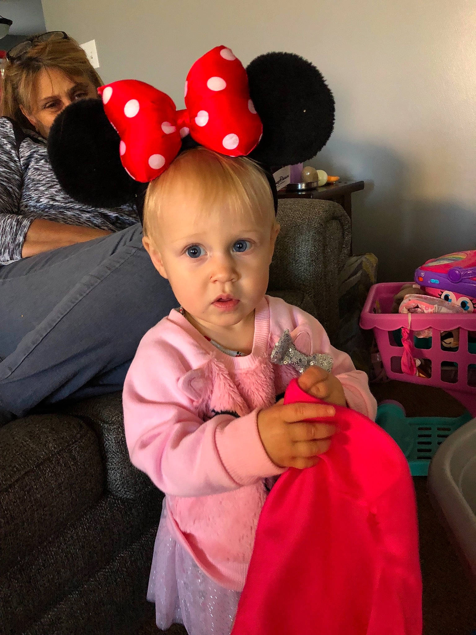 Abi is registered to the contest to win money with this photo: child, ear, hair_accessory, magenta, party_supply, person, pink, sitting, surprise, toddler
