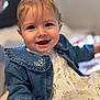 Ivy joined the competition — help win amazing prizes! baby, child, smiling, denim_jacket, floral_dress, blue_bow, happy, portrait, indoor, cute, young_child, face, person, closeup, infant, hand, eyelashes, soft_lighting, expression, warm