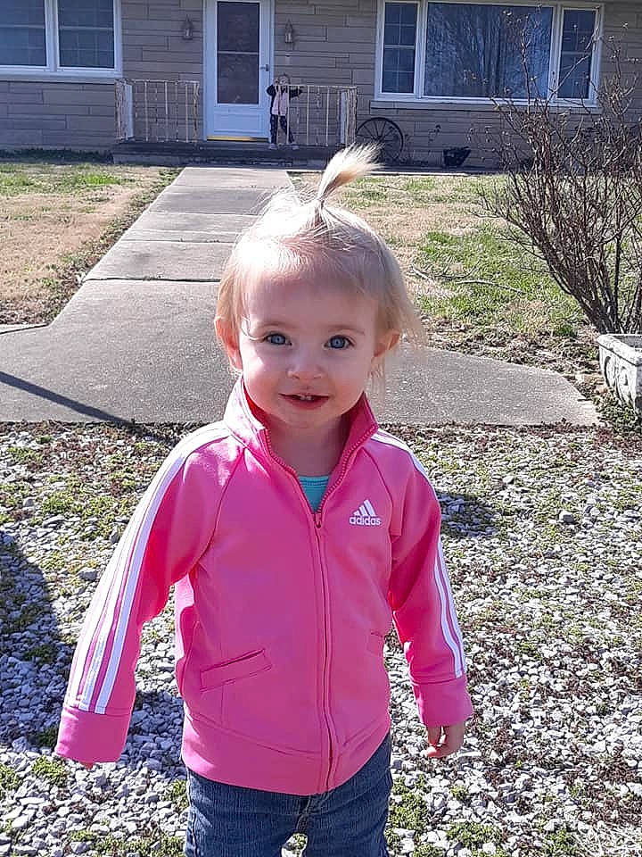 Olivia Jade is registered to the contest to win money with this photo: child, grass, jacket, outerwear, person, pink, plant, smile, t_shirt, toddler, yard