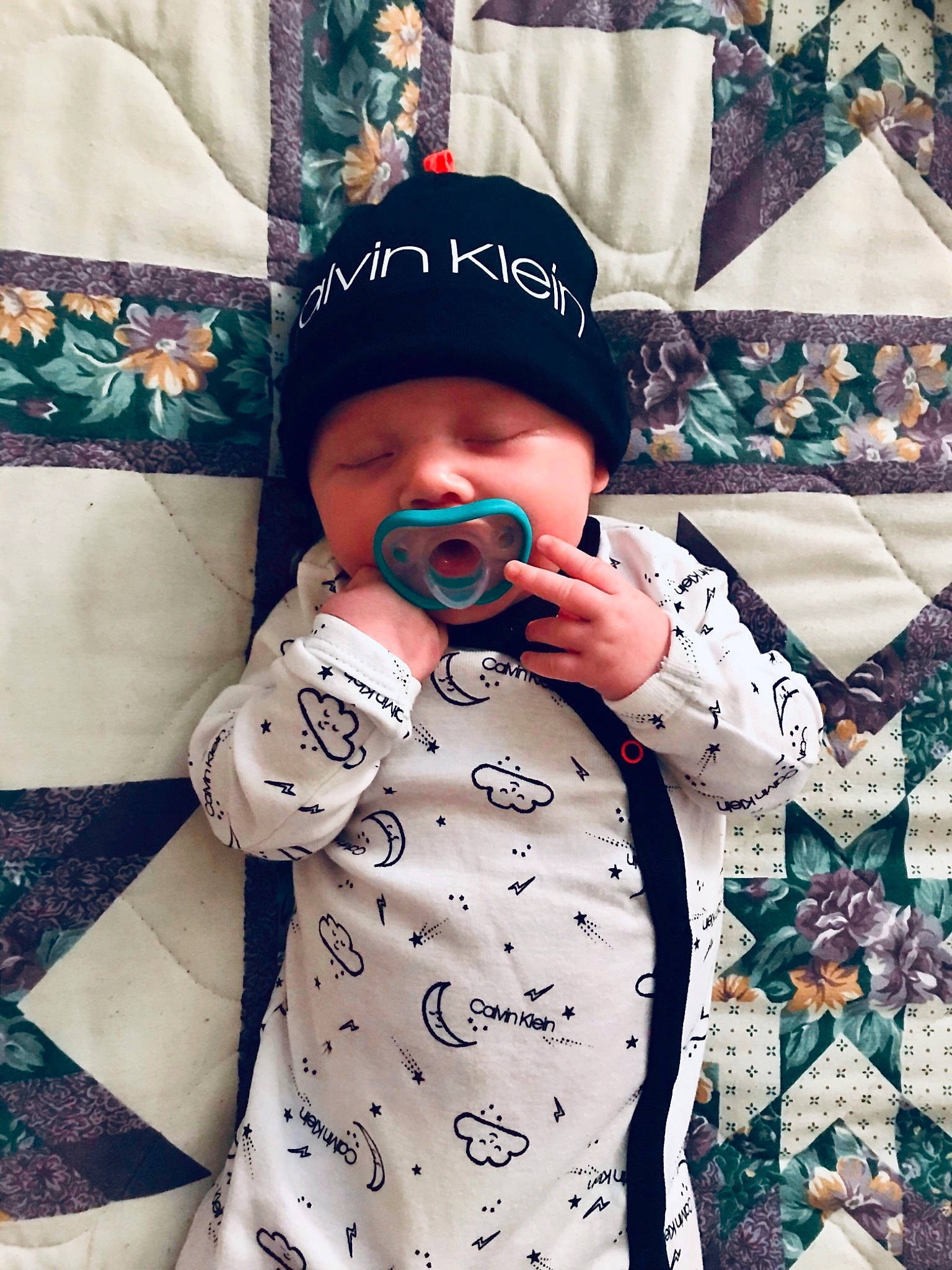 Ashtyn is registered to the contest to win money with this photo: arm, baby, baby_toddler_clothing, cap, cool, dress, eyewear, finger, glasses, hand, hat, head, headwear, person, product, shirt, sleeve, sunglasses, t_shirt, textile
