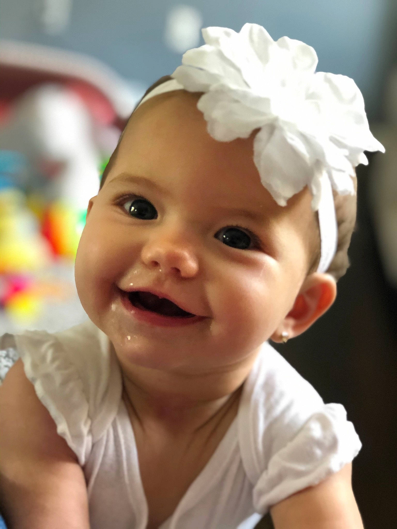 Makenna is registered to the contest to win money with this photo: baby, cheek, child, child_model, chin, ear, face, facial_expression, fashion_accessory, hair_accessory, happy, head, headband, headgear, headwear, joy, lip, person, photography, skin