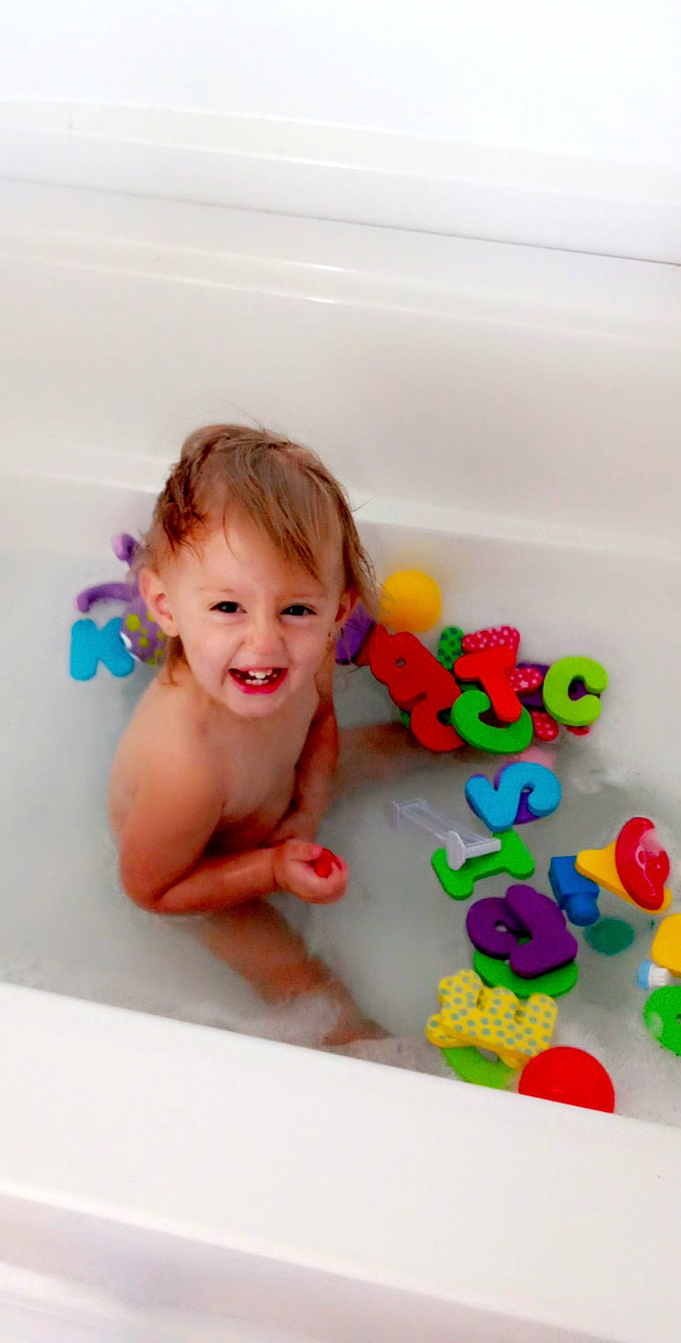 Allison Joe joined the competition — help win amazing prizes! art, baby, baby_playing_with_toys, baby_products, baby_toys, bath_toy, bathing, bathroom, bathtub, child, circle, fun, happy, joy, leisure, magenta, person, play, room, sitting