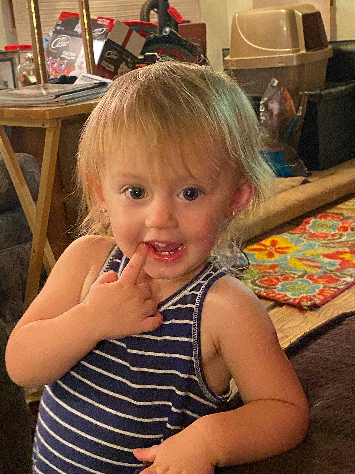 Allison Joe is registered to the contest to win money with this photo: baby_toddler_clothing, bag, chair, cheek, child, eyebrow, eyelash, finger, floor, flooring, fun, gesture, happy, human_body, iris, long_hair, person, skin, smile, thumb