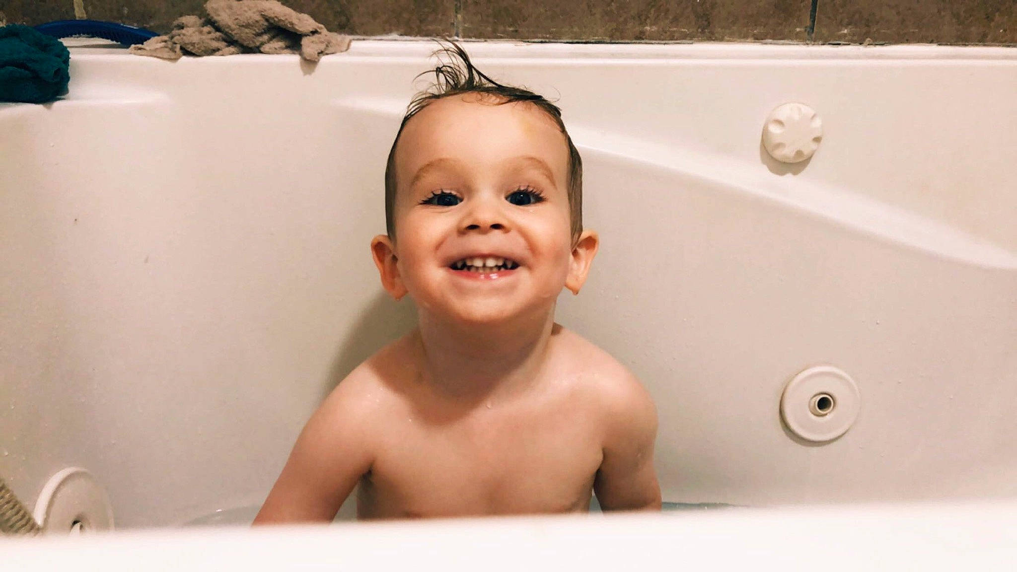 Connor is registered to the contest to win money with this photo: baby, baby_bathing, bathing, bathroom, bathtub, child, face, facial_expression, forehead, fun, happy, joy, person, plumbing_fixture, room, skin, smile, toddler, washing