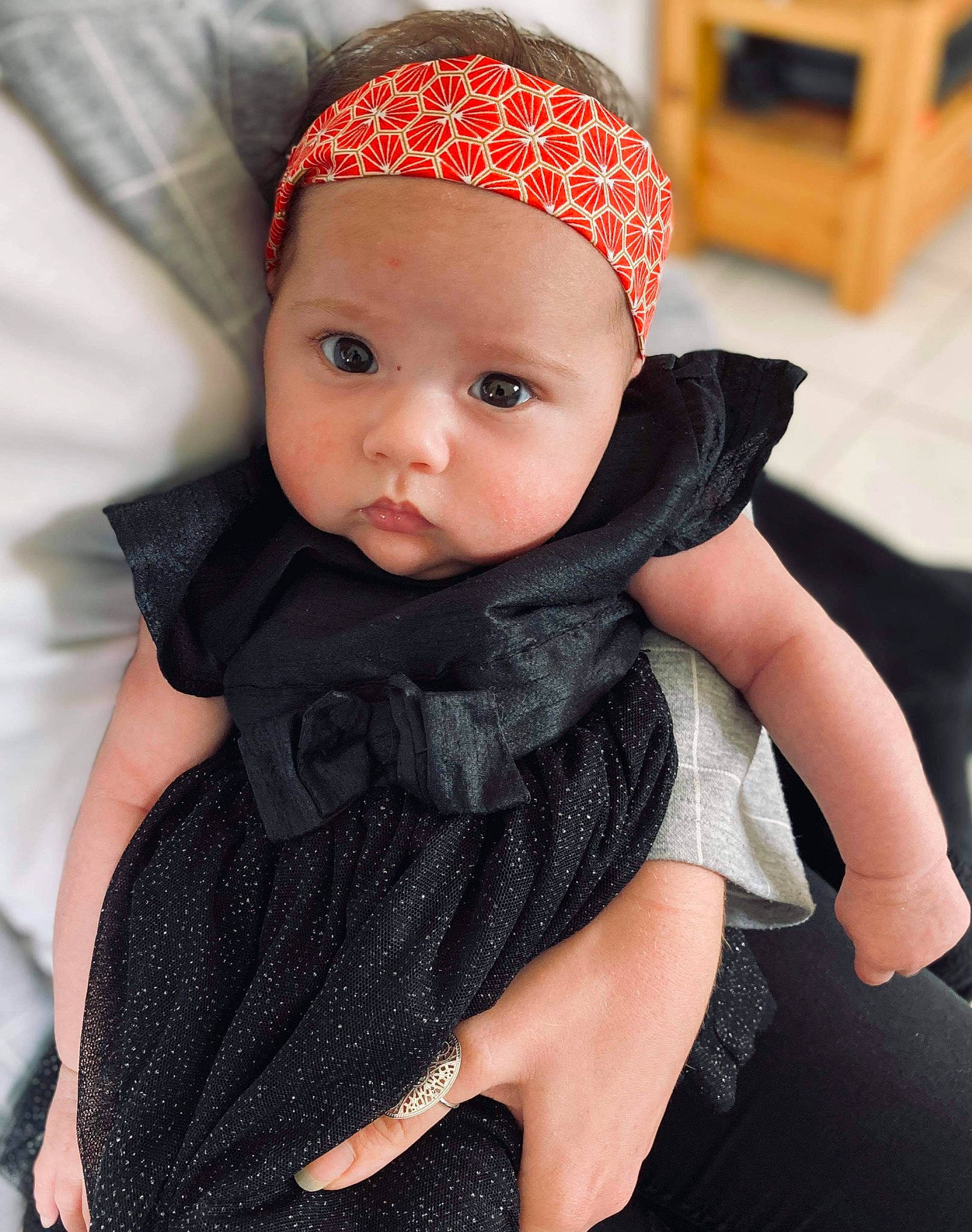 Kataleya participe au concours pour gagner de l'argent avec cette photo : baby, baby_products, beanie, bonnet, cap, cheek, child, child_model, clothing, face, fashion_accessory, hair_accessory, hat, head, headgear, headwear, knit_cap, lip, outerwear, person