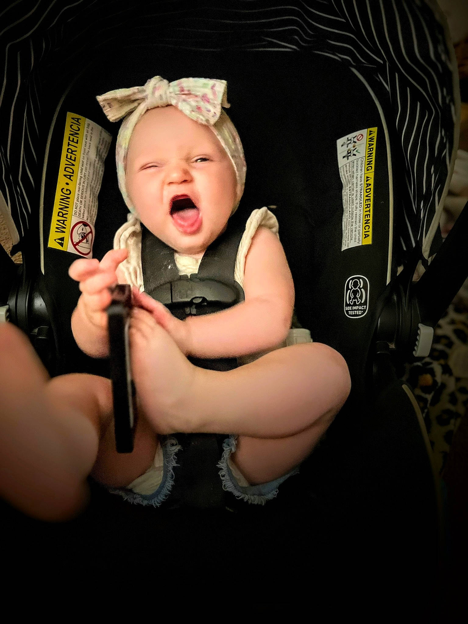 Preslee is registered to the contest to win money with this photo: auto_part, baby, baby_carriage, baby_products, baby_toddler_clothing, cap, car_seat, chair, comfort, eyewear, fashion_accessory, flash_photography, gesture, hat, headwear, leg, person, personal_protective_equipment, sitting, thigh