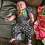 Kaliyah joined the competition — help win amazing prizes! baby, infant, couch, blanket, clothing, tshirt, pants, floral_pattern, feet, face, smile, playful, indoor, carpet, person, child, home, fabric, socks, soft_toys