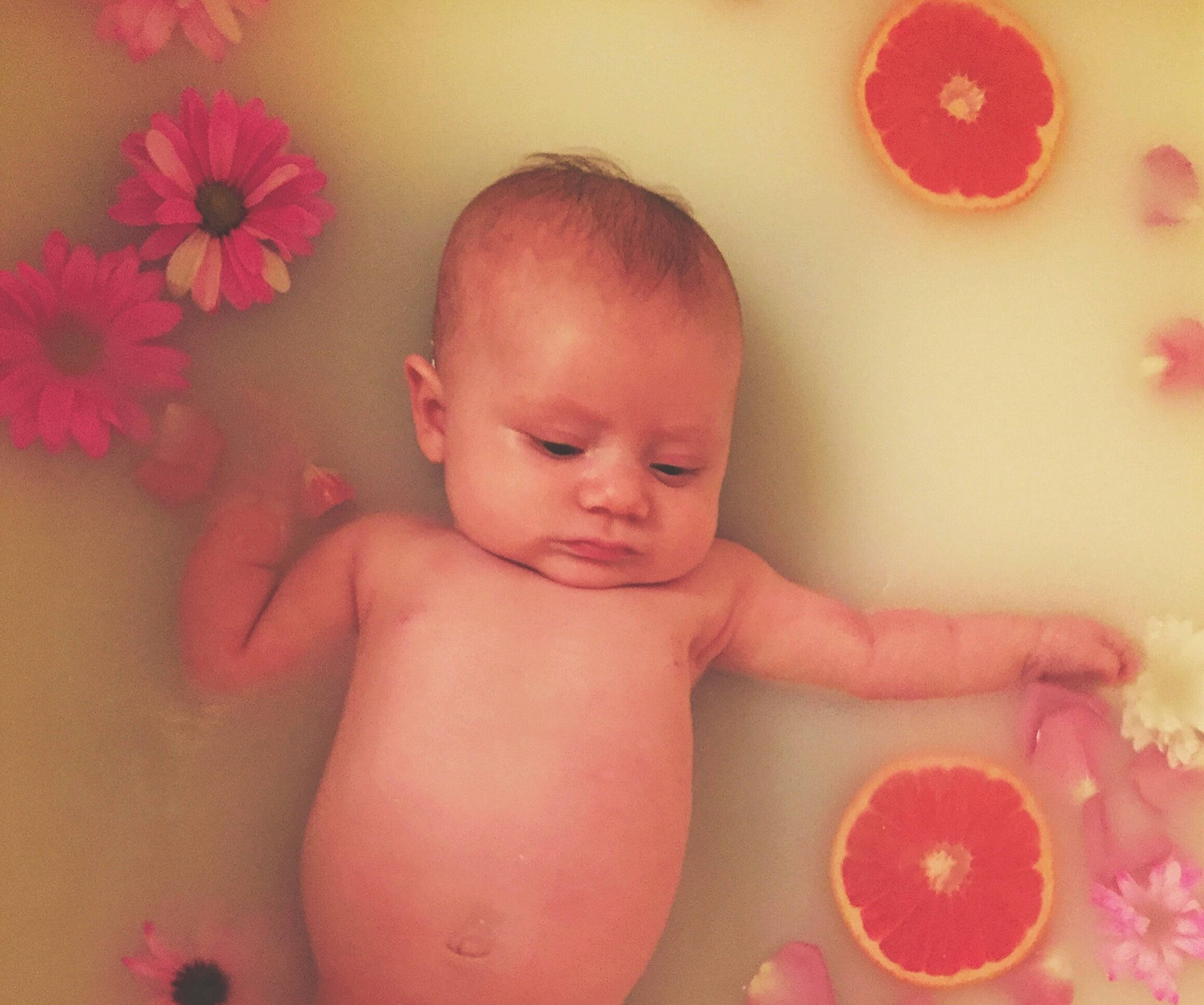 Lyla is registered to the contest to win money with this photo: art, baby, baby_sleeping, bathing, cheek, child, face, flesh, head, lip, mouth, peach, person, petal, photography, pink, plant, skin, stomach, toddler