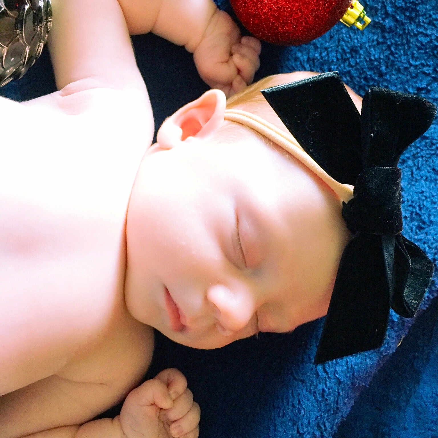 Lyla is registered to the contest to win money with this photo: arm, baby, black_hair, child, fashion_accessory, finger, hair_accessory, hand, hat, headgear, photography, skin, toddler