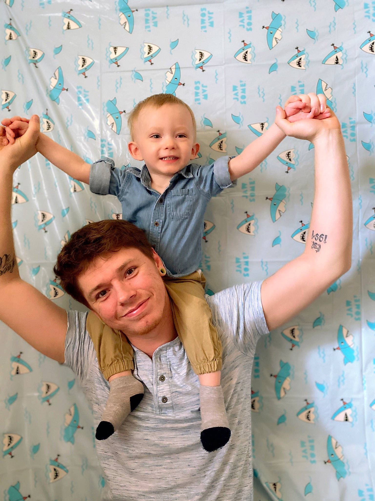 Hendrix is registered to the contest to win money with this photo: arm, baby, child, family, finger, fun, gesture, hand, happy, holding_hands, joy, leisure, people, person, photography, play, sibling, smile, thumb, toddler