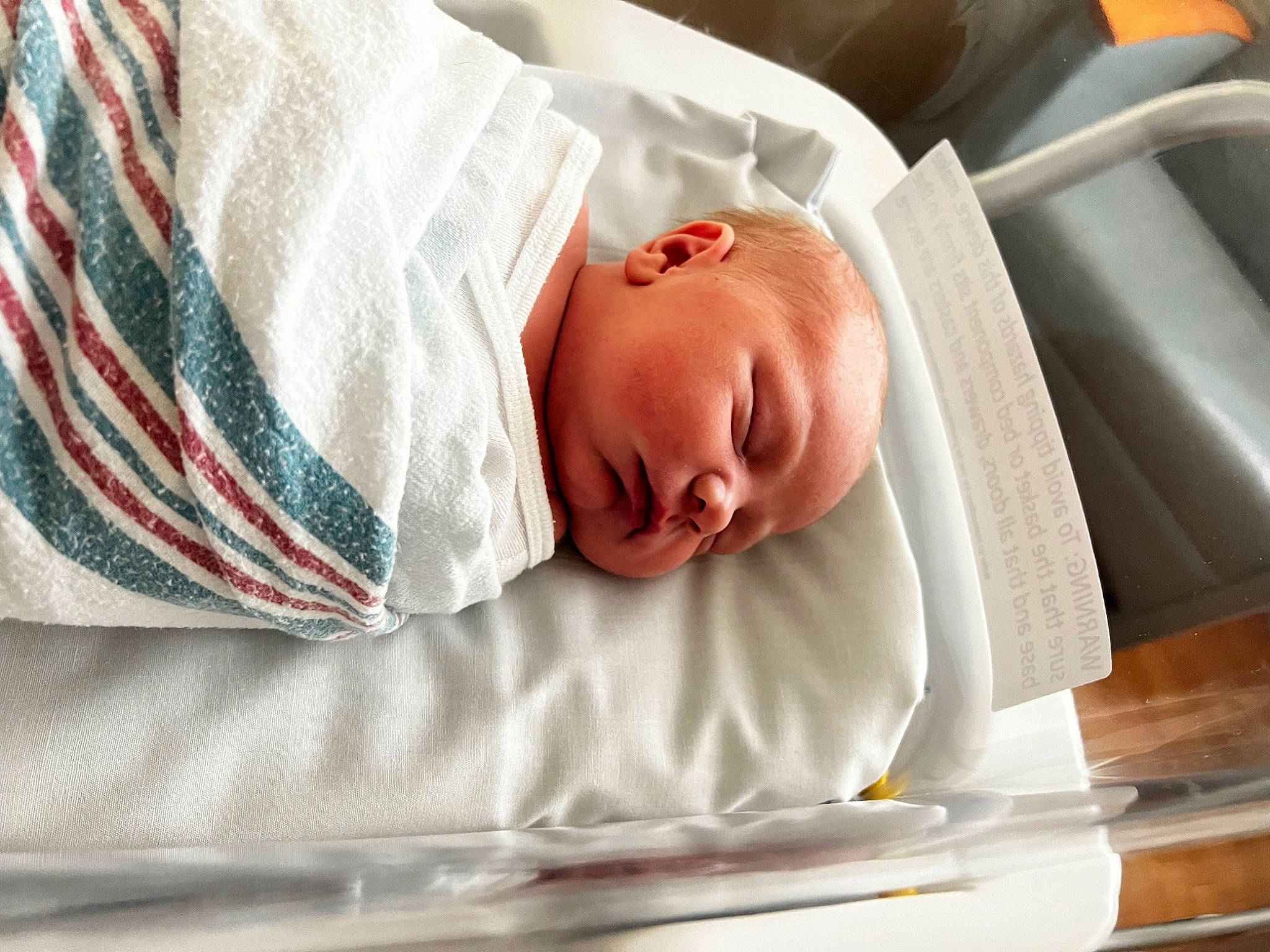 Aiden is registered to the contest to win money with this photo: baby, baby_products, baby_sleeping, bed, bed_sheet, bedding, bedtime, blanket, child, comfort, event, health_care, hospital, linens, nap, person, room, service, sleep, sleeve