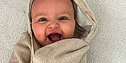 Kiara joined the competition — help win amazing prizes! baby, blanket, child, cozy, cute, expression, eyes, face, floor, happy, head, indoor, infant, mouth, person, skin, smile, towel, wrapped, young