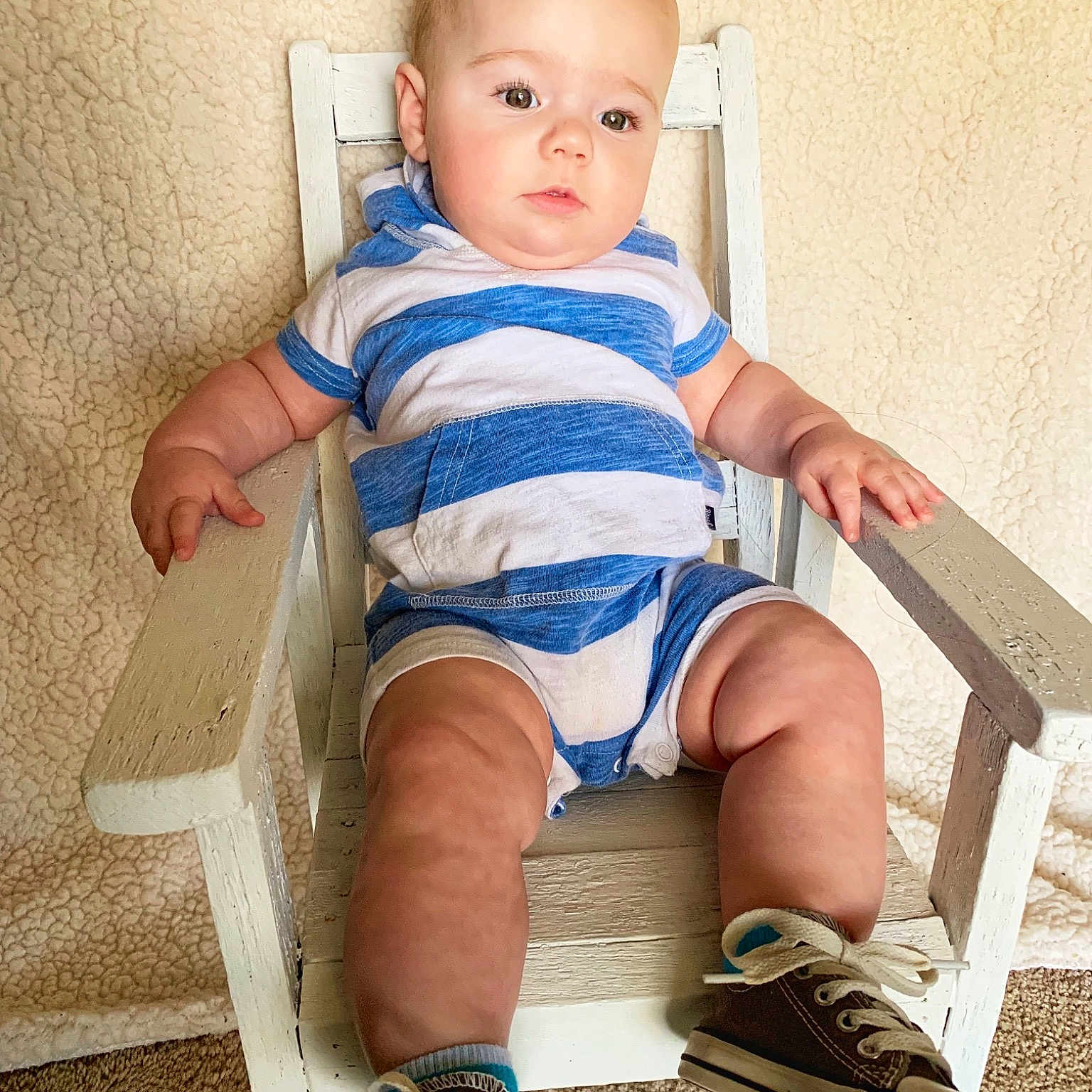Duke joined the competition — help win amazing prizes! baby, baby_toddler_clothing, chair, child, footwear, furniture, human_leg, knee, leg, person, shoe, sitting, toddler, vacation