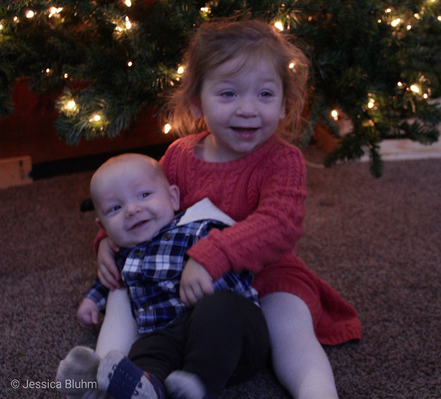 Brinlee is registered to the contest to win money with this photo: child, christmas, day, emotion, eye, facial_expression, fun, girl, happiness, holiday, hug, infant, interaction, joy, lap, laughter, people, person, sitting, skin