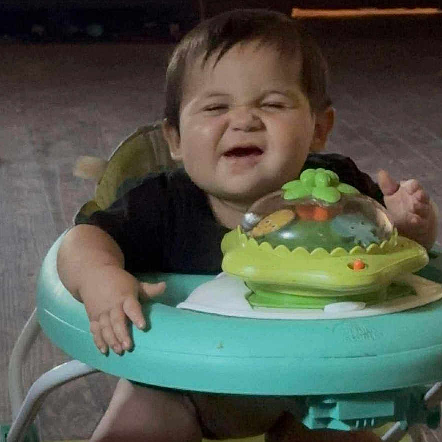 Jackson Tank joined the competition — help win amazing prizes! baby, walker, toy, indoor, floor, child, funny_face, candid, cute, smiling, chubby, legs, hands, black_shirt, play, infant, expression, person, home, young