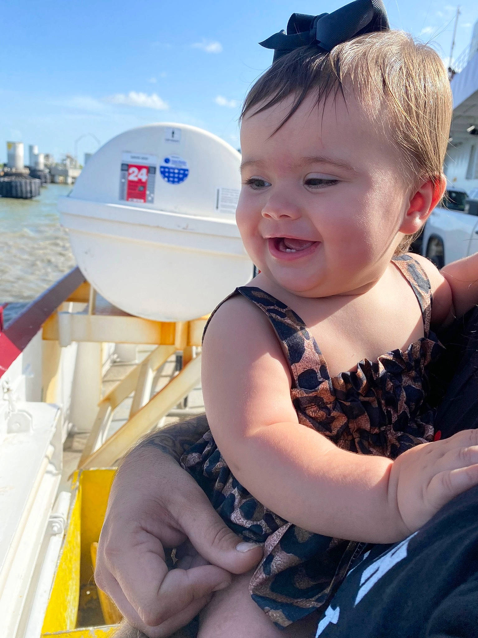 Sailor is registered to the contest to win money with this photo: baby, baby_toddler_clothing, boat, boats_and_boating_equipment_and_supplies, cloud, electric_blue, fun, happy, lake, leisure, naval_architecture, person, recreation, sky, smile, summer, toddler, travel, vehicle, water
