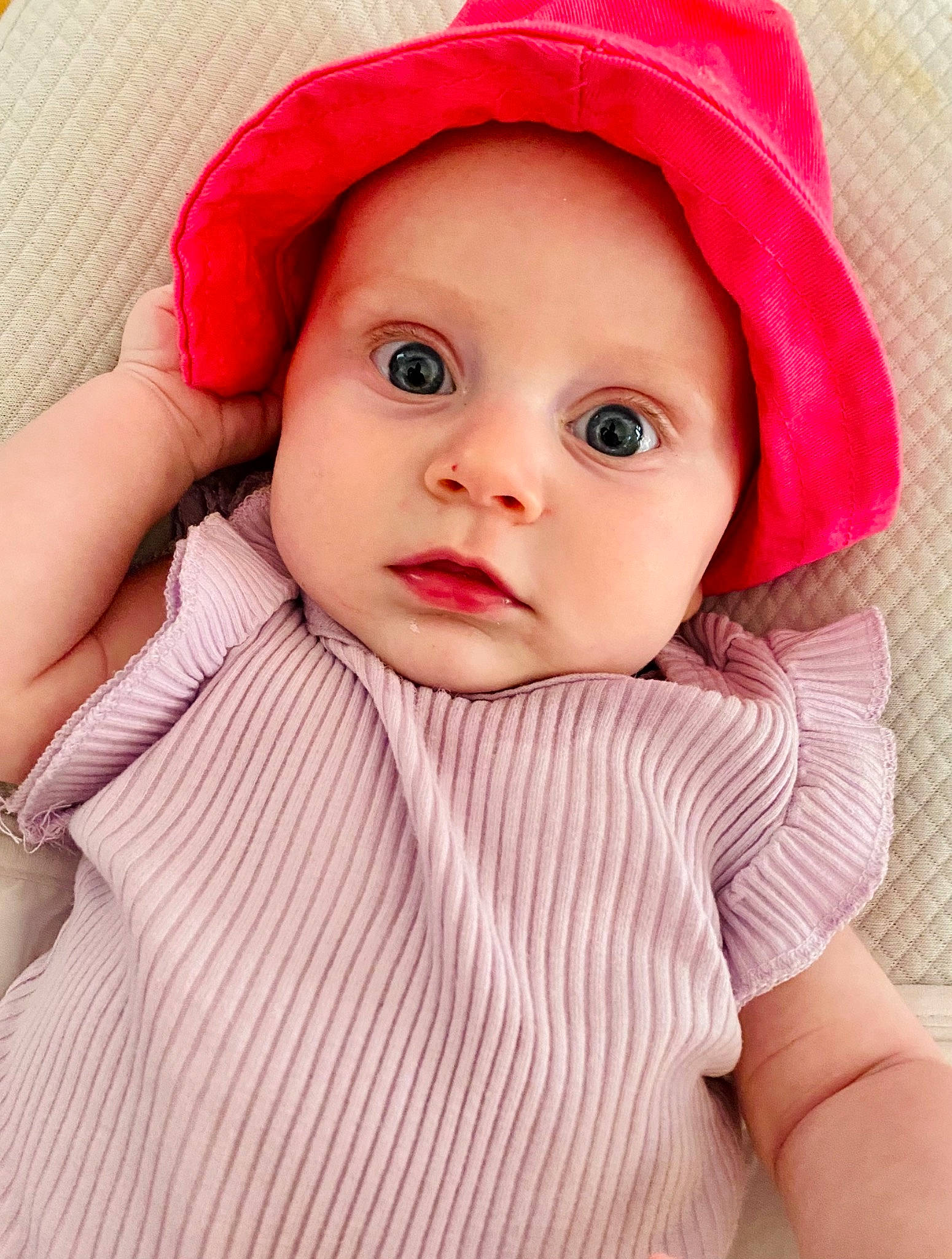 ève participe au concours pour gagner de l'argent avec cette photo : baby, baby_toddler_clothing, cap, cheek, clothing, comfort, eye, eyebrow, eyelash, face, hat, headwear, iris, lip, mouth, nose, outerwear, person, pink, skin