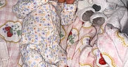 Mia joined the competition — help win amazing prizes! baby, newborn, sleeping, blanket, plush_toy, cow, pajamas, floral_pattern, cozy, child, infant, soft, cute, resting, indoors, peaceful, comfort, person, sleep, toy