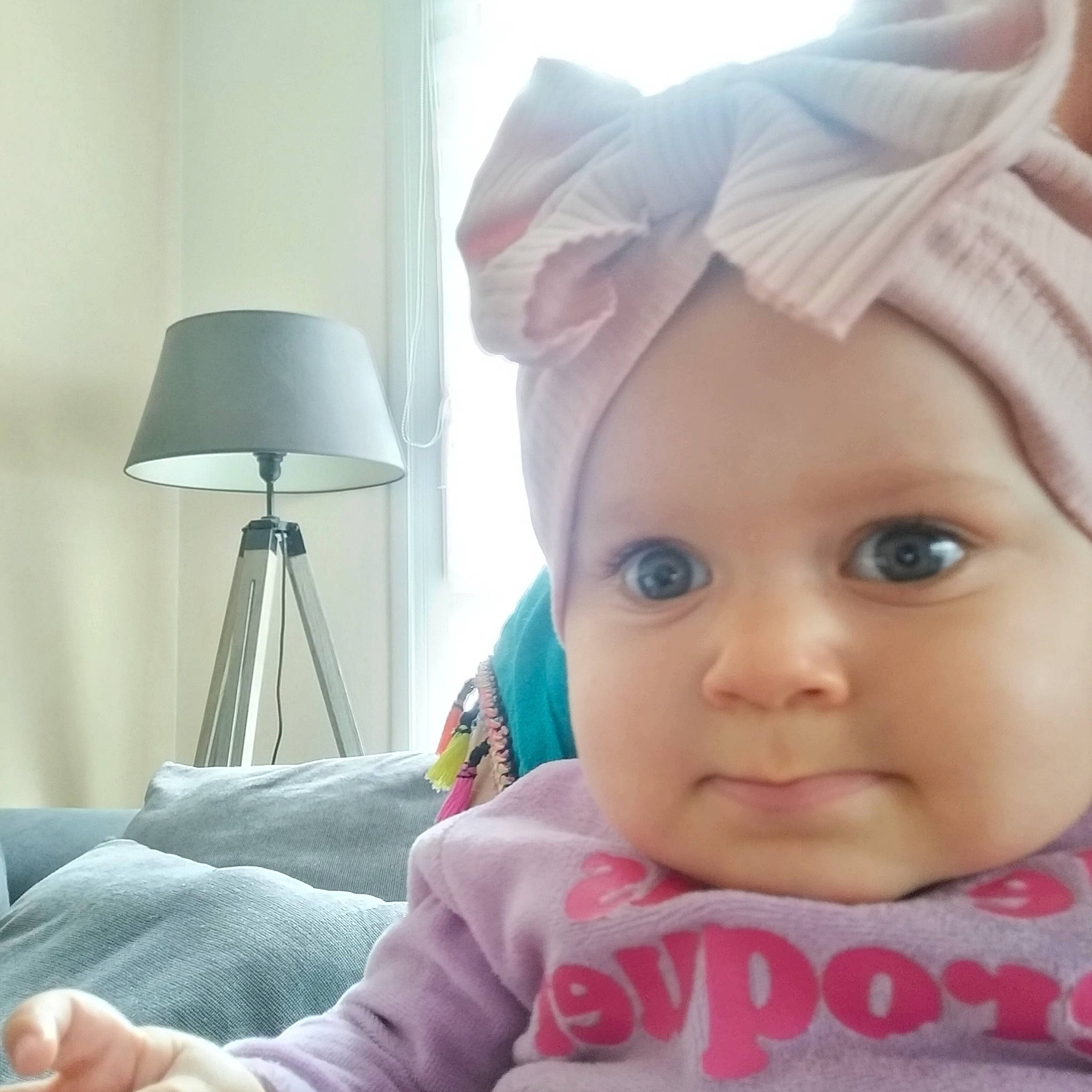 Djenna participe au concours pour gagner de l'argent avec cette photo : baby, cap, child, comfort, doll, eyelash, fashion_accessory, finger, happy, hat, headwear, lamp, linens, lip, person, pink, room, selfie, textile, toddler