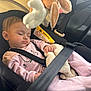 baby, sleeping, car_seat, safety_belt, plush_toy, pink_onesie, child, infant, car_interior, seatbelt, soft_toy, doll, cute, peaceful, resting, child_safety, car_travel, toddler, interior, seat