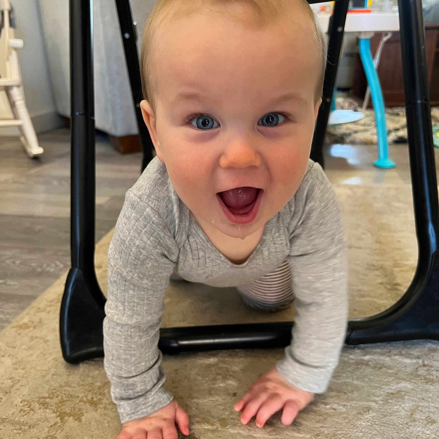 Easton joined the competition — help win amazing prizes! baby, blue_eyes, carpet, chair, child, clothing, crawling, curious, cute, drool, floor, furniture, happy, indoor, long_sleeve, person, playful, smiling, wooden_floor, young_child