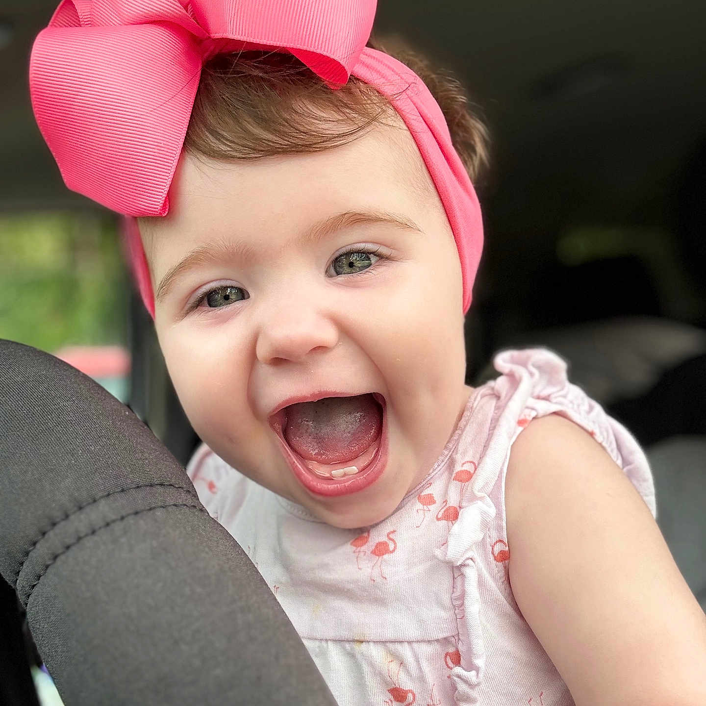 Amelia joined the competition — help win amazing prizes! arm, baby, child, closeup, clothing, cute, face, happy, headband, indoors, infant, joy, patterned_dress, person, pink_bow, portrait, sleeveless, smiling, soft_light, teeth