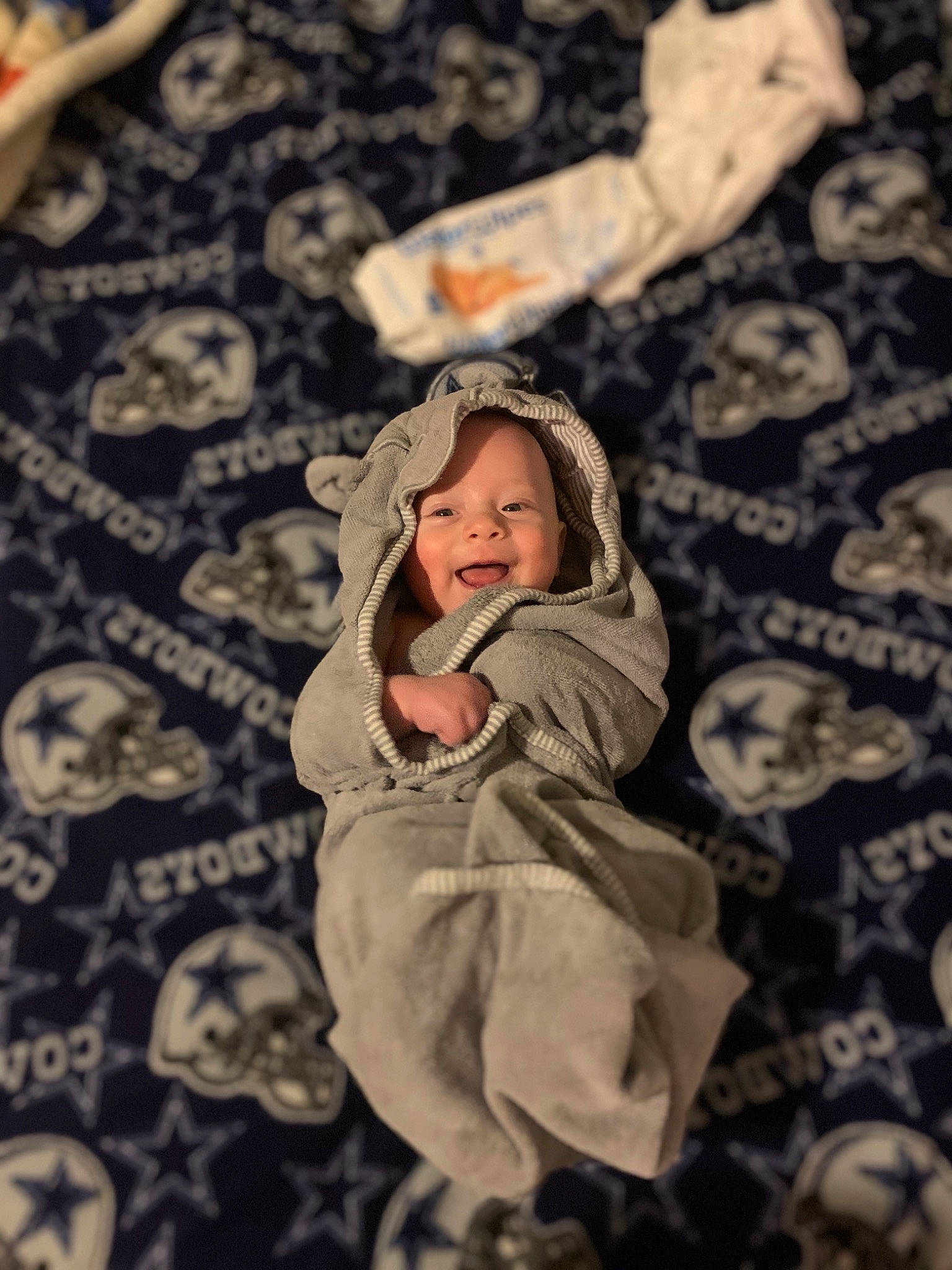 Cohen is registered to the contest to win money with this photo: baby, child, event, eye, face, flash_photography, floor, flooring, fun, grass, hairstyle, happy, head, joy, pattern, people_in_nature, person, plant, room, toddler