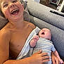Eden participe au concours pour gagner de l'argent avec cette photo : child, baby, laughing, yawning, couch, gray, cozy, indoor, family, sibling, happy, smiling, holding, blanket, shirtless, casual, home, living_room, infant, person