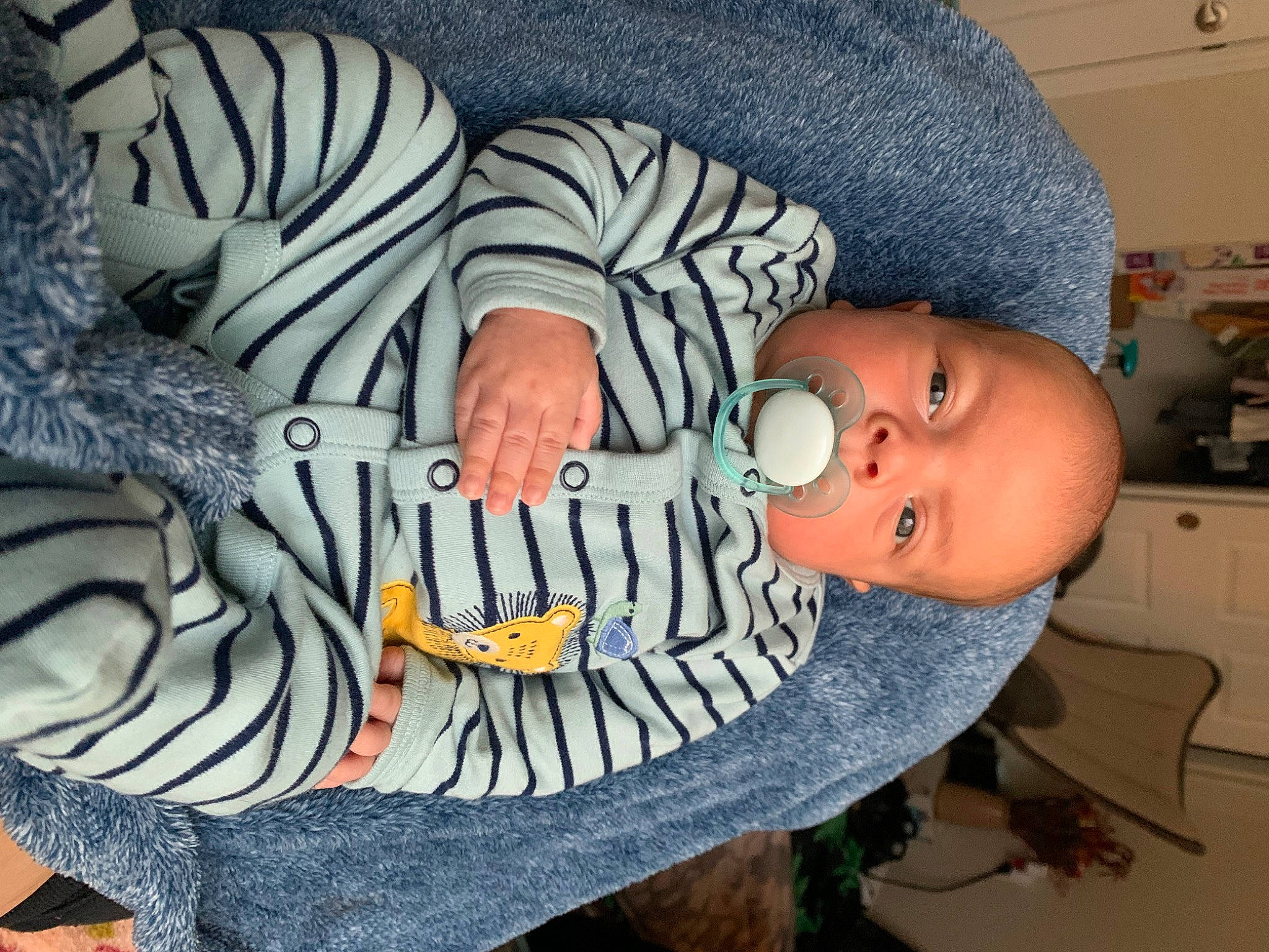 Dorian joined the competition — help win amazing prizes! baby, baby_products, baby_toddler_clothing, child, comfort, flesh, font, fur, hat, headgear, human_body, nail, pattern, person, personal_protective_equipment, sitting, sleeve, thumb, toddler