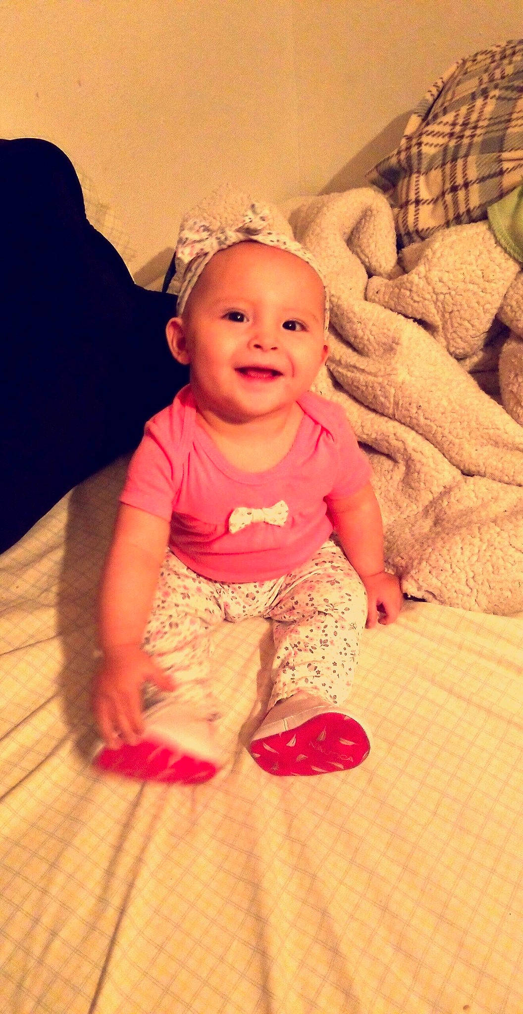 Mayla joined the competition — help win amazing prizes! cheek, child, day, eye, girl, hair_accessory, head, headgear, human_hair_color, infant, leg, mouth, person, pink, red, sitting, skin, smile, standing, textile