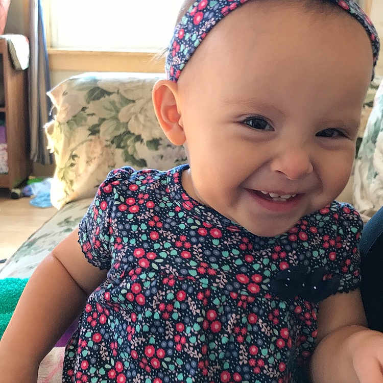Mayla is registered to the contest to win money with this photo: cheek, child, day, design, ear, fashion_accessory, girl, hair_accessory, head, headband, headgear, headpiece, infant, joy, pattern, person, pink, product, skin, smile