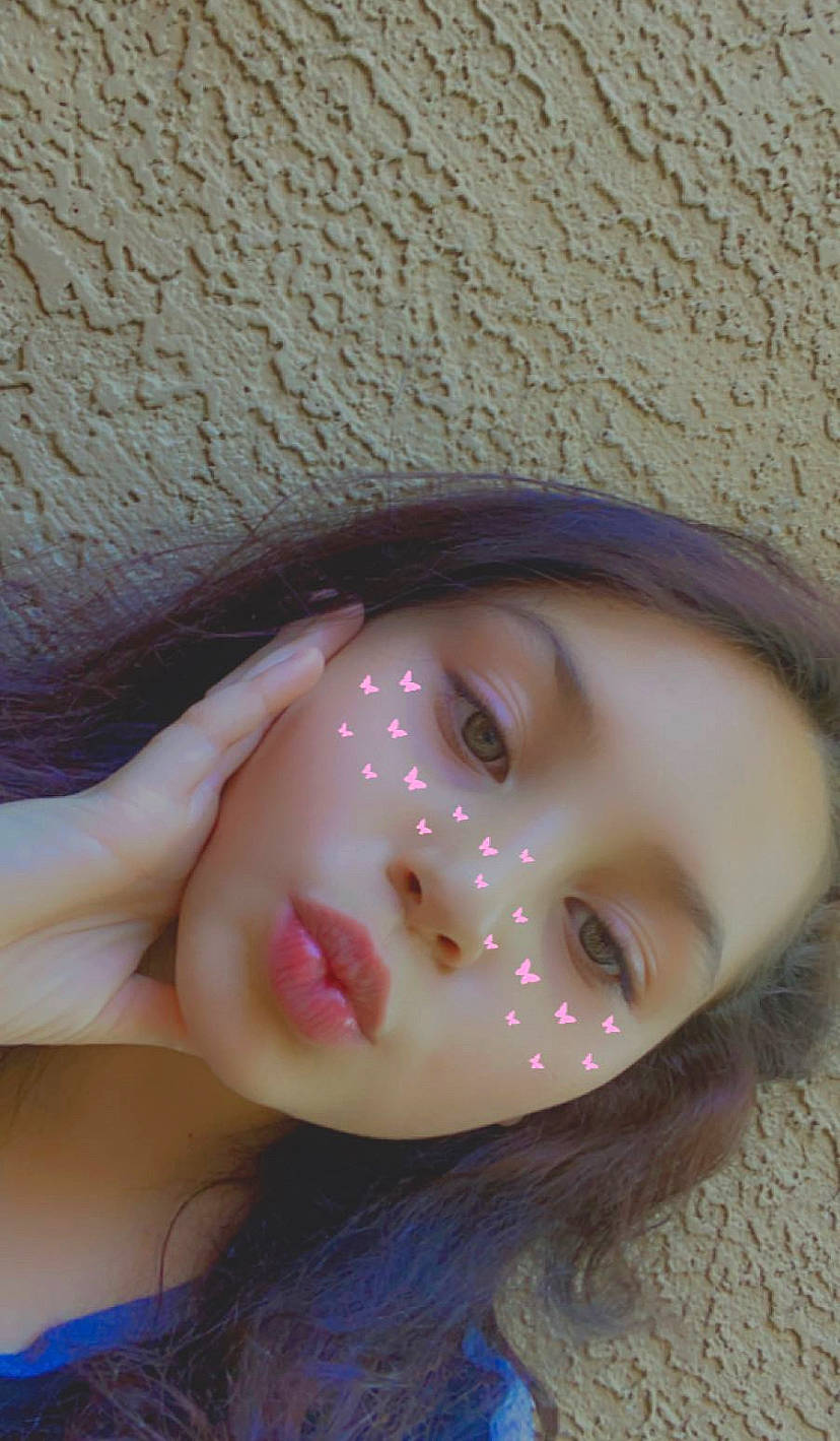 Justice is registered to the contest to win money with this photo: cheek, chin, close_up, doll, eye, eyelash, face, fashion_accessory, fawn, forehead, hat, head, headgear, lip, mouth, nose, person, pink, skin, toy