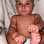 baby, infant, bare_chest, diaper, holding_feet, wide_eyes, curious, plush_blanket, soft_texture, cute, child, portrait, skin, hand, foot, fingers, toes, expression, sitting, indoors