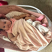 Rose joined the competition — help win amazing prizes! baby, baby_rocker, blanket, child, clothing, comfort, cute, floor, indoor, infant, looking, lying, person, pink, portrait, relaxing, resting, socks, soft, wrapped