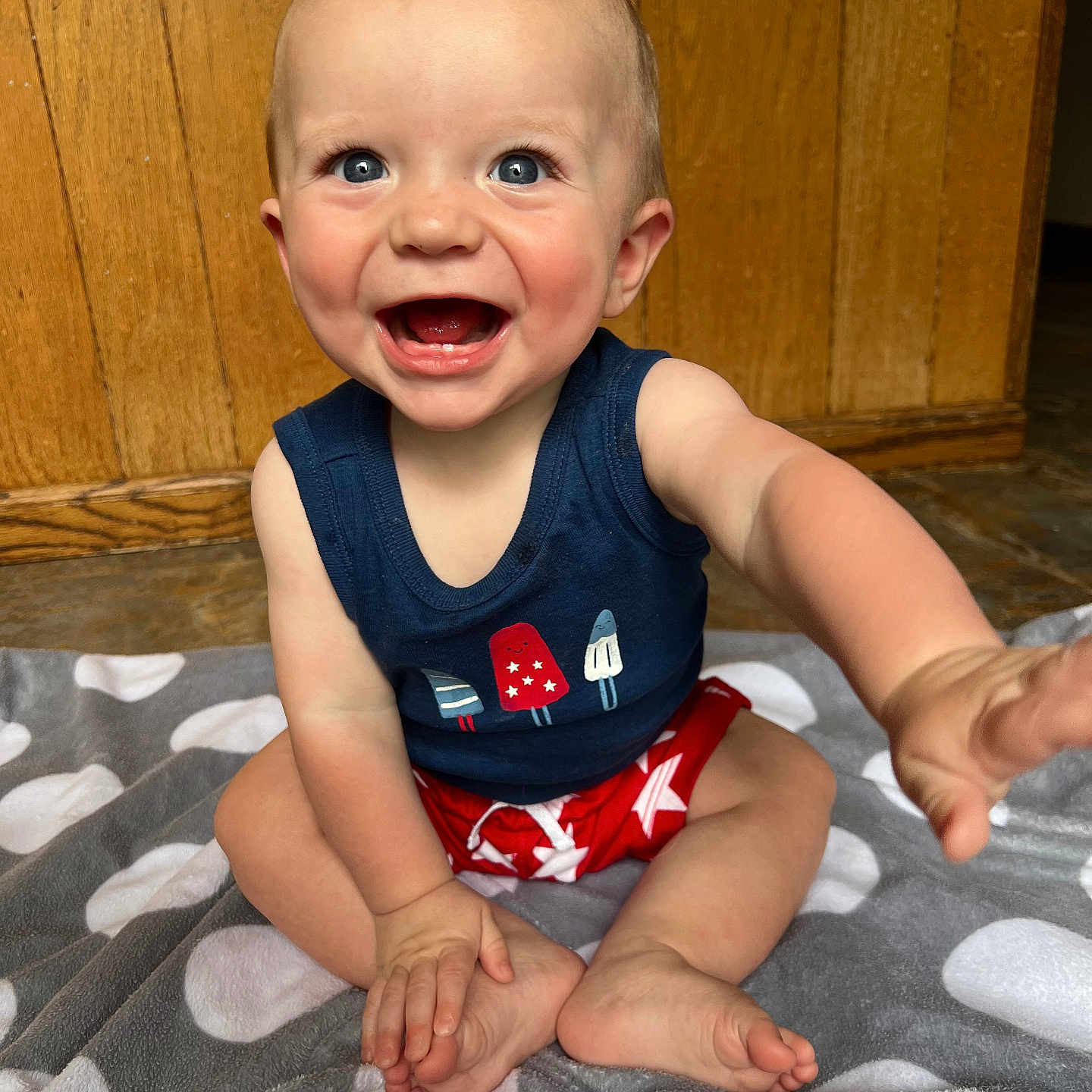 Kasen joined the competition — help win amazing prizes! baby, babylaughing, bodypart, clothing, dress, face, finger, hand, happy, head, laughing, pants, person, photography, portrait, shorts, sitting, smile, t_shirt, wood