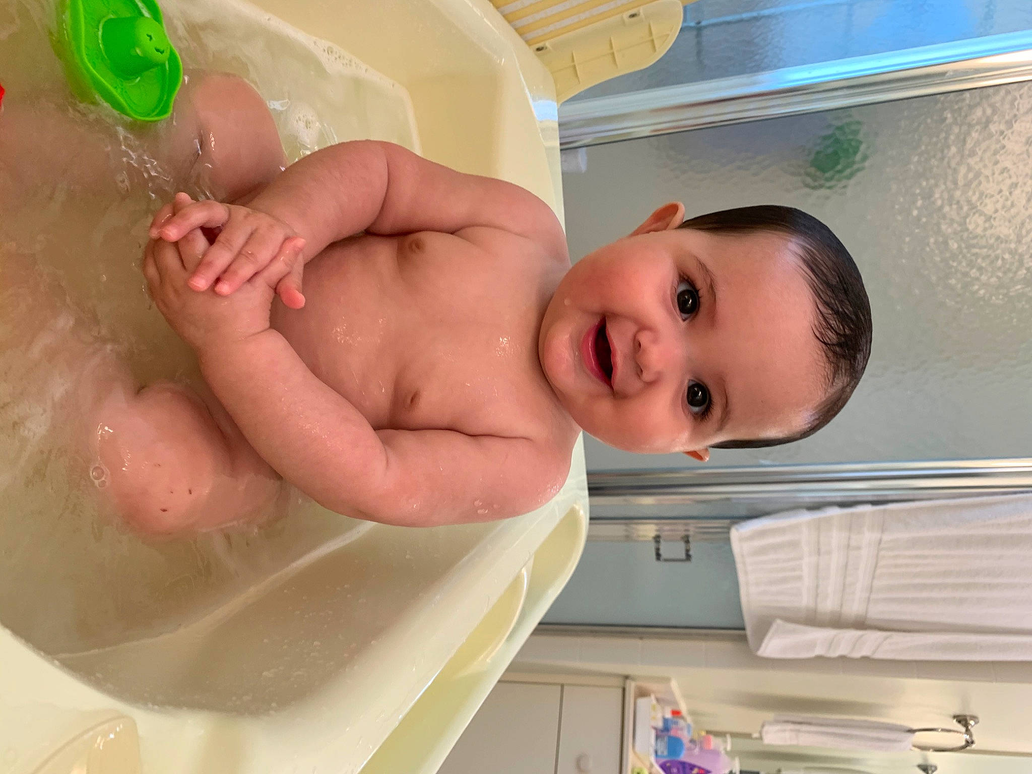 Amaia is registered to the contest to win money with this photo: arm, baby, baby_bathing, baby_products, bathing, bathtub, cheek, chest, eye, eyebrow, face, fluid, fun, head, joy, mouth, person, skin, smile, stomach