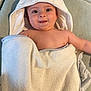 Jaime a rejoint le concours — aidez-le/la à gagner de superbes lots ! baby, towel, hooded_towel, smile, face, skin, child, infant, cute, happy, lying_down, blanket, soft, indoor, young_child, expression, person, head, comfort, warmth