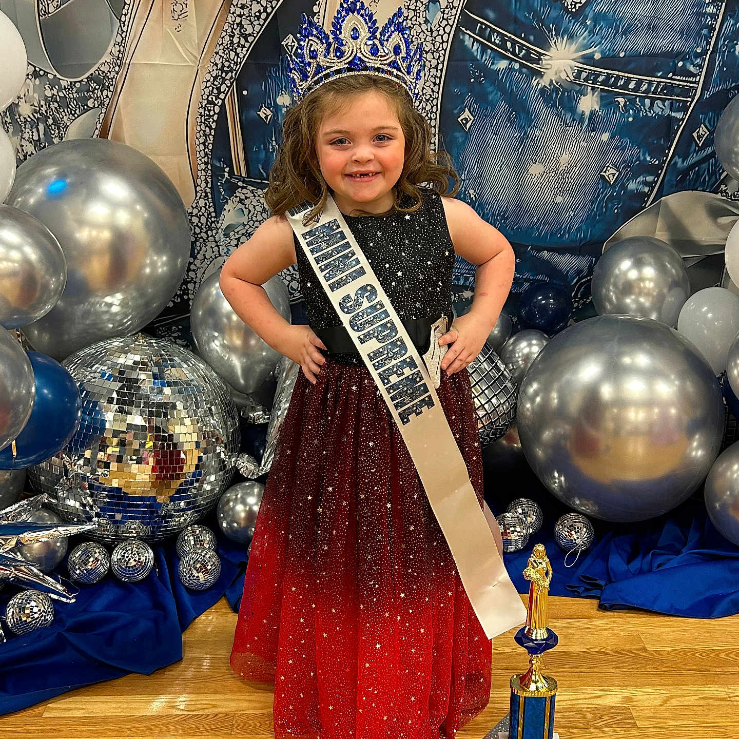 Rylie is registered to the contest to win money with this photo: accessories, blade, bottle, child, cosmetics, crown, dagger, face, female, girl, head, jewelry, knife, lady, perfume, person, sash, sphere, student, weapon