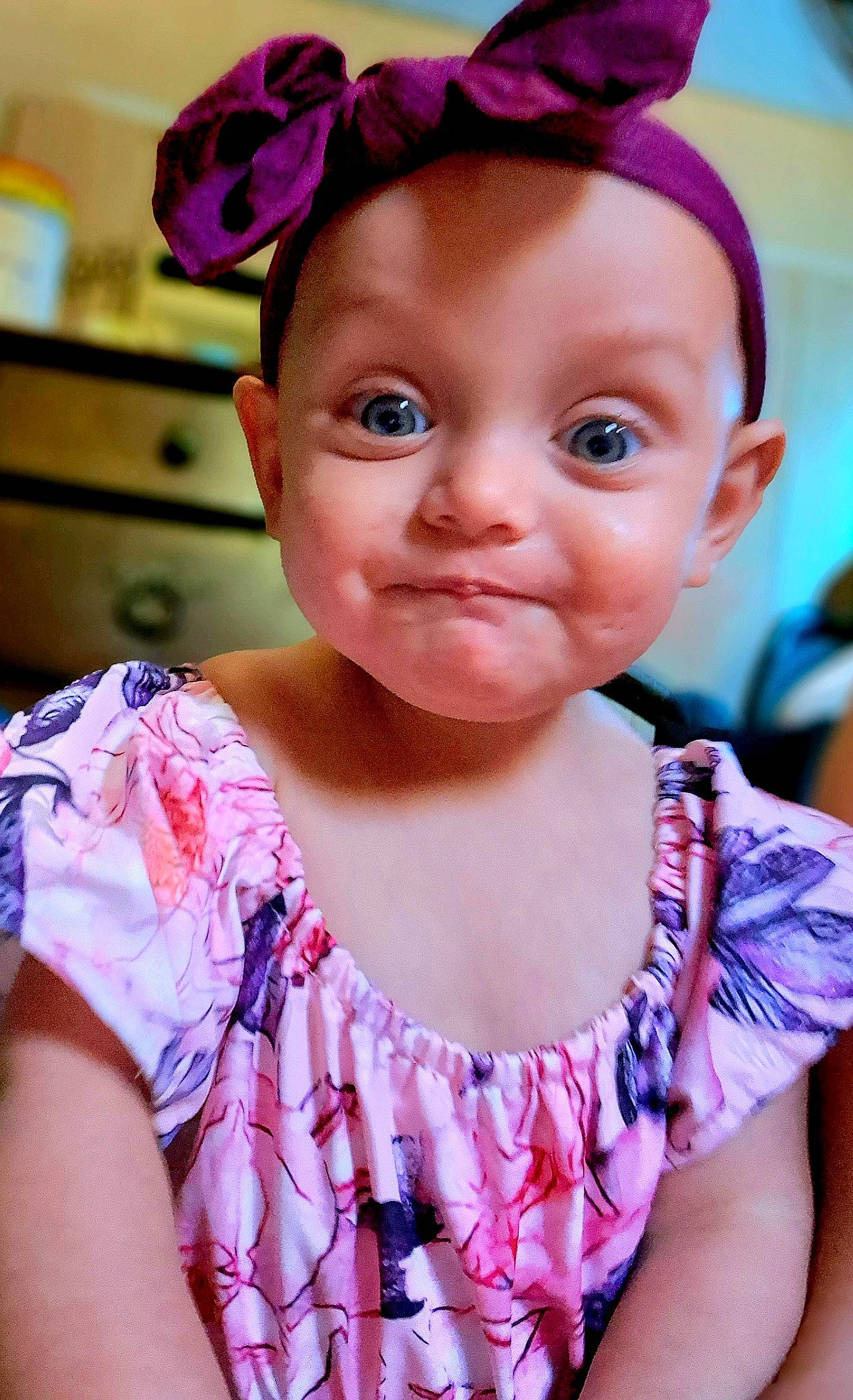 Amanda is registered to the contest to win money with this photo: baby_toddler_clothing, cheek, chin, eye, eyebrow, eyelash, facial_expression, hairstyle, happy, headpiece, human, iris, jewellery, lip, person, pink, purple, skin, smile, summer