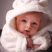 Hugo is registered to the contest to win money with this photo: baby, infant, face, hood, towel, white, soft, cute, closeup, portrait, skin, eyes, expression, blanket, texture, warm, cozy, child, newborn, cuddly
